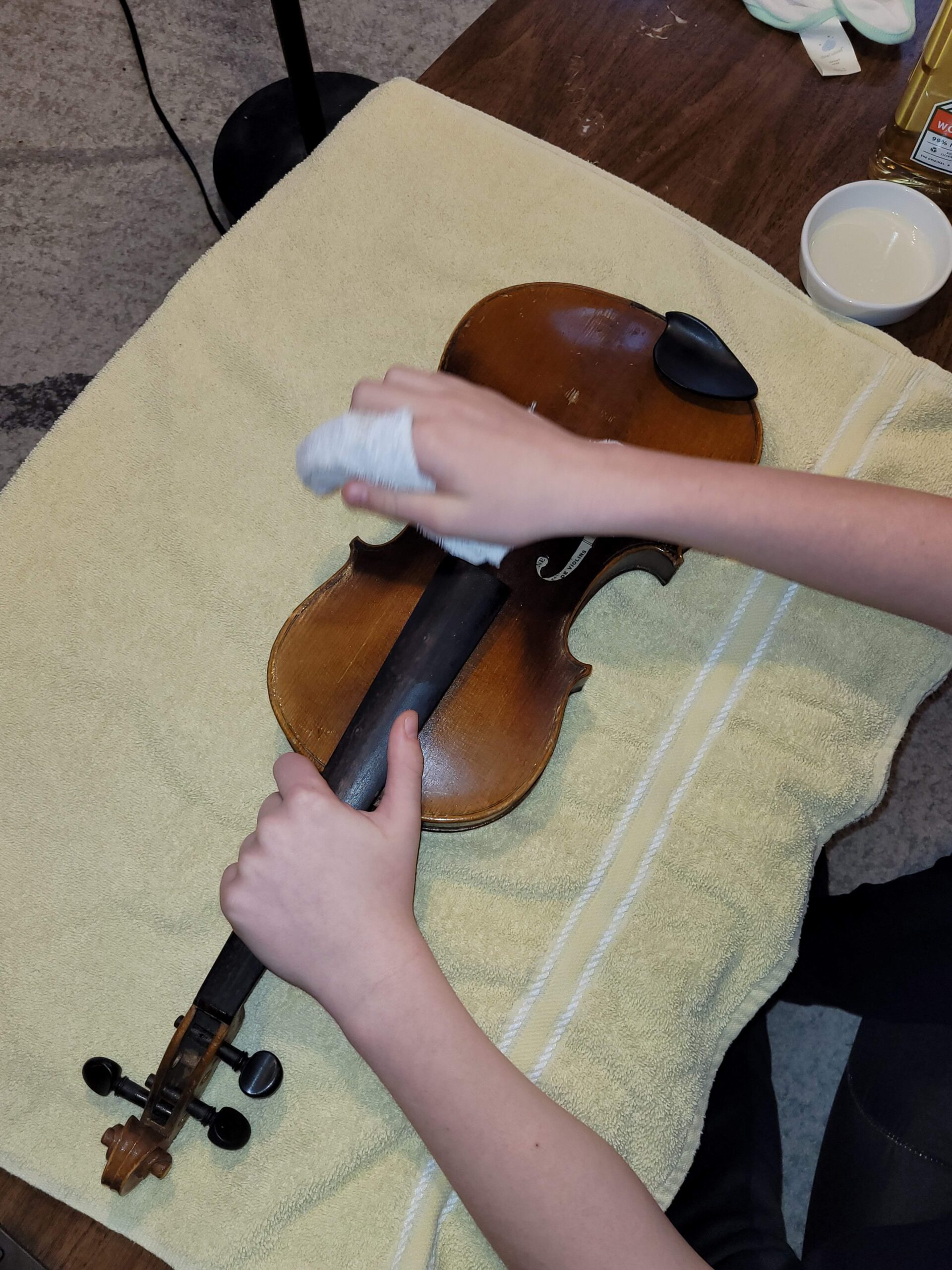 The Ellis Newton violin being cleaned