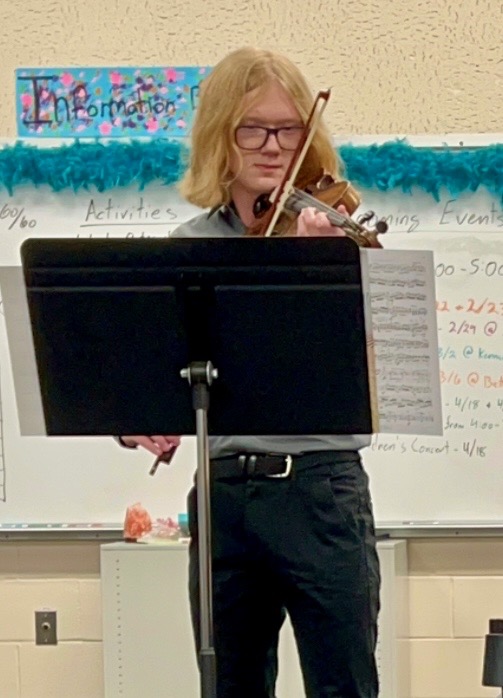 Simon Marble playing the restored violin.